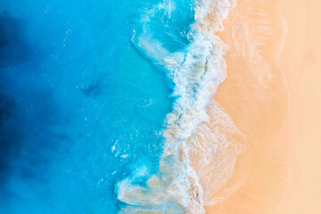 Wall Mural - coast as a background from top view. waves and beach. aerial landscape. azure water background from 