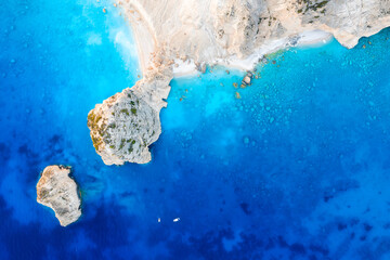 Wall Mural - view from the air on the waves and rocks. sea relaxation and travel. azure water on the sea. a brigh