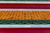 Fototapeta Tęcza - Colorful roof tiles on the Wat Suthat Buddhist Temple in Bangkok