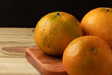 Wall Mural - Delicious ripe tangerines on cutting board.