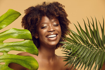 Smiling African American girl with natural make-up.