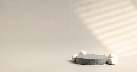 Poster - Minimal stone stage product display with sunlight from window on cream color background