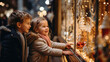 Leinwandbild Motiv small children stand on the street near a shop window decorated with New Year's garlands