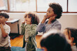 © Jacob Lund - School children learning a nursery rhyme in a class
