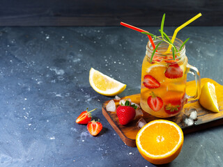 Wall Mural - refreshing summer lemonade with strawberry, orange and lemon. copy space