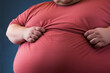Close up of an obese mans overweight tummy. Unhealthy waistline