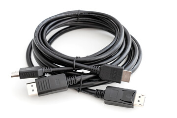 DisplayPort and HDMI Cable for connecting a computer to a monitor and other multimedia consumer electronics, close-up in selective focus on a white background