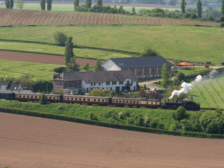 Wall Mural - Hilly landscape with Poplar trees and steam train in Wittem-Gulpen in South Limburg, the Netherlands