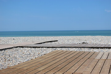 Wall Mural - Terrasses en planches sur la plage de galets à Dieppe