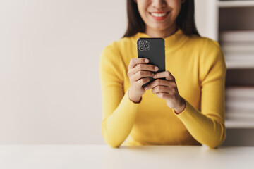 Portrait of a young woman holding a mobile phone to use social media on a smartphone. Communicate via the Internet on a smartphone. concept of using technology in communication