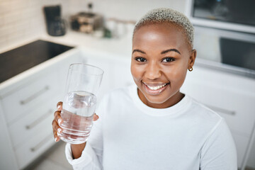 Wall Mural - Portrait, glass or black woman drinking water, kitchen or health with nutrition, happiness or wellness. Face, female person or girl with liquid for energy, home or detox with peace, calm or apartment