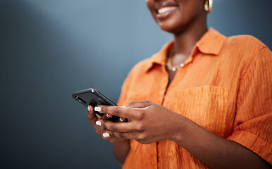 Aufkleber - Typing, happy and hands with a phone on a dark background for communication or social media. Smile, contact and a black woman with a mobile for an app or chat isolated on a studio backdrop for web