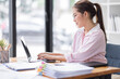 © David - Business asian women working on laptop in office, calculating income-expenditure and analyzing real estate investment data, Accounting Financial and tax systems concept.