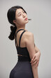 © Dialogue Frame - beautiful Asian woman exercising indoors