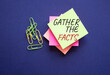 © Natallia - Gather the facts symbol. Yellow steaky note with paper clips with words Gather the facts. Beautiful deep blue background. Business and Gather the facts concept. Copy space.