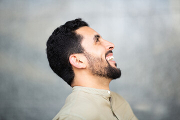 Wall Mural - Profile view of young north african guy smiling