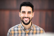 © mimagephotos - Portrait of handsome young arabic man smiling