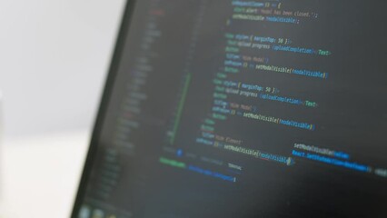 The programmer writes a program code, creating a program, on the screen, close