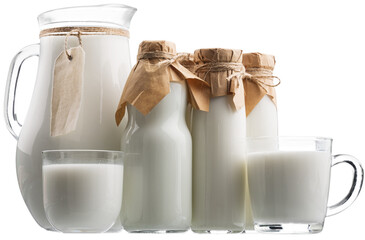 Canvas Print - Fresh organic milk in glass and jug on rustic wooden table on nature background.