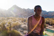 © Elena Ray - Photographs of a young black gay man practicing Reiki in the desert.