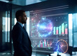 © Gaston - Businessman in front of holographic financial charts. Man next to digital screens with graphs and charts
