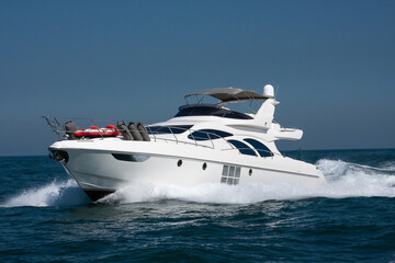 White yacht sailing in a calm sea