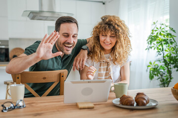 couple husband and wife man woman use digital tablet for video call