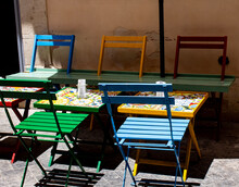 Colorful Tables And Chairs On The Streets Of Ortigia In Siracusa, Italy
