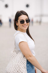 Wall Mural - Smiled pretty woman in sunglasses and denim. Happy female