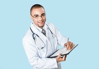 Wall Mural - Portrait of handsome young doctor posing