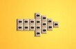 Arrow icon on wooden cubes on color background