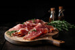 Slices of jamon serrano ham or prosciutto crudo parma on wooden board with rosemary. Wooden background,ai generated