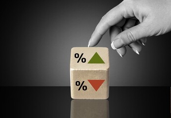 Poster - Symbol of interest rate. wooden cube with arrow