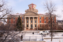 Winter View On University Of Manitoba Administration Building With Students Bwore It Crossing Chancellors Circle Covered With Snow