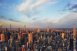 © Tetra Images - USA, New York, New York City, Aerial view of Manhattan skyscrapers at sunset