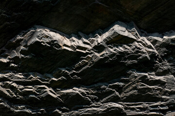 Dark Rock textured background. Surface stone texture. Solid concept. Abstract natural pattern for design.