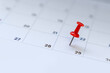 © PBXStudio - A red tack on the calenda. Planning for business meeting or travel planning concept.