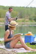 © auremar - happy young couple fishing on the lake