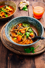 Wall Mural - Thai red vegetarian curry with mushrooms and vegetables