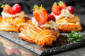 Wall Mural - Delicious flaky fresh baked Danish Pastry with Chantilly cream and fresh fruit.