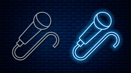 Wall Mural - Glowing neon line Microphone icon isolated on brick wall background. On air radio mic microphone. Speaker sign. Vector