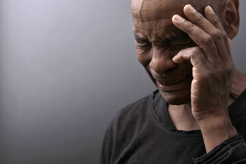 man praying to god with prayer with devotion Caribbean man praying on black background with people stock photos stock photo	