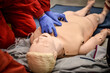 Paramedics simulate emergency intervention on medical training manikin