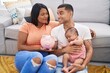 © Krakenimages.com - Young hispanic couple with baby holding piggy bank smiling looking to the side and staring away thinking.