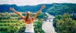 © M.studio - Happy woman with open arms enjoying panoramic view of Dordogne landscape and river- France