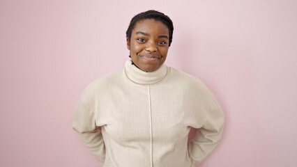 Poster - African american woman smiling confident standing over isolated pink background