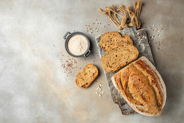 Wall Mural - Sliced bread. Baked bread. Craft bakery on wooden board, banner, menu, recipe place for text, top view