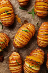 Wall Mural - baked hasselback potato with cheddar cheese and rosemary