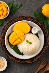 Wall Mural - Delicious Thai mango sticky rice with cut fresh mango fruit in a plate.