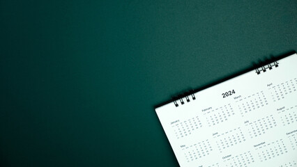 Calendar year 2024 schedule on green dark background.
2024 calendar planning appointment meeting concept. 
copy space.
top view.